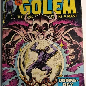 Puede incluir: Portada de cómic vintage de Strange Tales #177 con The Golem. La ilustración de la portada muestra una figura musculosa en una bola de cristal, con un gran monstruo y el texto "DOOMS-DAY FOR A DEMI-GOD!" en un recuadro azul. El cómic es de Marvel Comics Group.