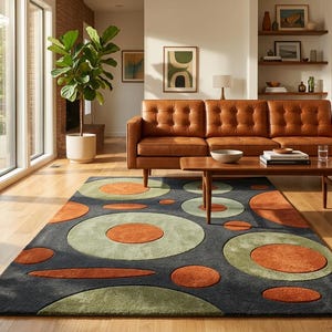 May include: A living room scene featuring a brown leather sofa, a wooden coffee table, and a patterned rug. The rug has a dark gray background with orange and green circular designs. Large windows and plants add natural light and a touch of greenery.