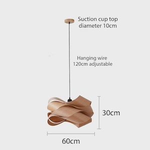 May include: A wooden pendant light with a unique, layered design. The light fixture is 30cm tall and 60cm wide, with a 10cm diameter suction cup top and a 120cm adjustable hanging wire. The light has a natural wood finish.