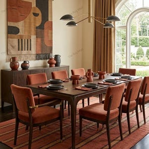 May include: A rectangular area rug featuring a terracotta and brown striped pattern with a textured weave. The rug is positioned under a dark wood dining table set with matching chairs, ceramic bowls, and plates in a dining room setting.