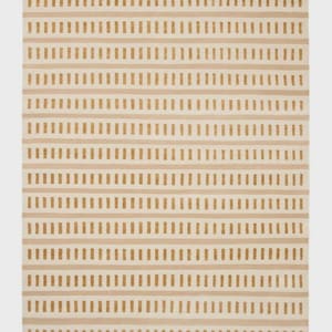 May include: A rectangular rug with a repeating pattern of horizontal stripes and vertical dashes. The rug features a neutral color palette with beige and tan tones, creating a simple, yet stylish design. This rug is suitable for living rooms, bedrooms, or entryways.