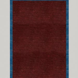May include: A rectangular rug with a deep burgundy center and a vibrant blue border. The rug's texture appears woven, adding visual interest. The color palette is rich and inviting, suitable for various interior styles.