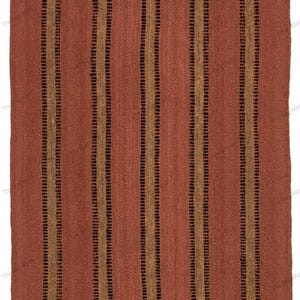 May include: A rectangular woven rug featuring a solid terracotta red base color. The rug is decorated with a repeating pattern of vertical stripes in alternating shades of dark brown and tan, creating a textured and linear visual appearance.