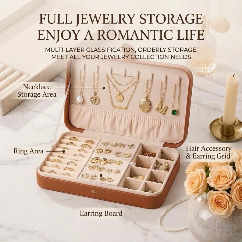 May include: Open brown jewelry storage box with multiple compartments for necklaces, rings, and earrings. The box is open, revealing various gold necklaces, rings, and earrings. Text on the image reads "FULL JEWELRY STORAGE ENJOY A ROMANTIC LIFE".
