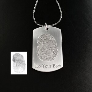 May include: Silver dog tag necklace with a fingerprint design and the inscription "Do Your Best".
