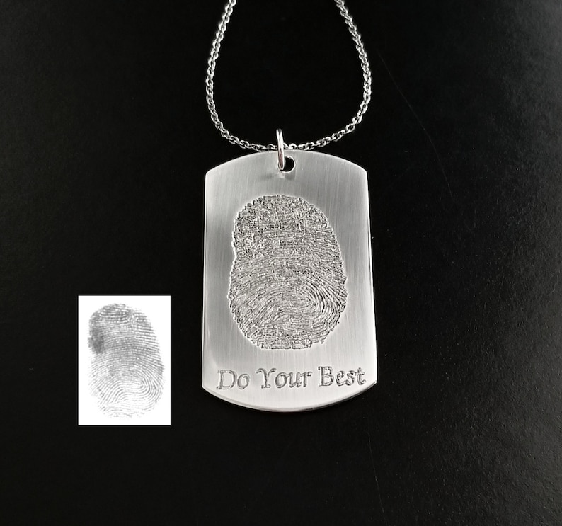 May include: Silver dog tag necklace with a fingerprint design and the inscription "Do Your Best".