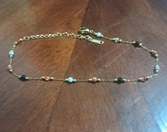 Tobillera de perlas doradas