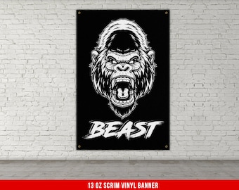 May include: Black and white vinyl banner with a roaring gorilla illustration and the word "BEAST" in white text. 13 oz scrim vinyl banner.