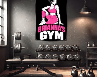 May include: A black banner with the text "BRIANNA'S GYM" in pink and white. The banner features an illustration of a woman in pink workout attire. Dumbbells, kettlebells, and weight racks are visible in the gym setting.
