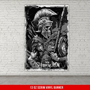 May include: Black and white illustration of a skeleton warrior wearing a helmet and holding a spear. The text "Iron Sharpens Iron" is below the warrior.
