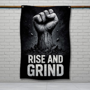 Puede incluir: Ilustración en blanco y negro de un puño rompiendo una superficie agrietada. El texto "Rise and Grind" está impreso debajo del puño.