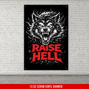 May include: Black banner featuring a detailed white illustration of a snarling wolf's head. Bold red text below reads "RAISE HELL". The banner is displayed against a white brick wall.