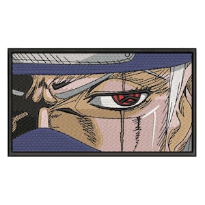 May include: Embroidered patch featuring a detailed close-up of an anime character's eye. The eye is red with a black design, surrounded by tan and white skin, and a blue head covering. The patch has a black border.