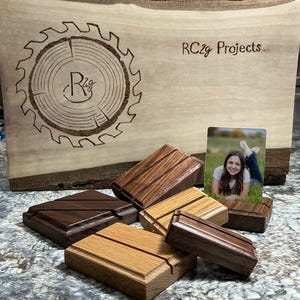 May include: A rustic wooden sign with the text "Welcome to our home" in white lettering. The sign features a distressed finish and a simple, inviting design, perfect for entryway decor.