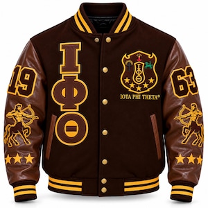 May include: A brown varsity jacket with gold accents, featuring the Greek letters Iota Phi Theta, the text Iota Phi Theta, the number 1963, and centaur graphics on the sleeves. The jacket has a snap-button front, ribbed collar, and cuffs.