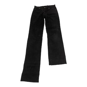 May include: Black corduroy trousers with a classic five-pocket design. The trousers have a straight leg cut and a button and zip closure. The fabric appears to be a soft, textured corduroy.