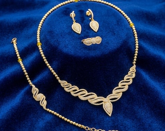 Conjunto de joyas de circonita chapado en oro de 22 quilates, collar y pendientes con diseño ondulado, conjunto nupcial llamativo.
