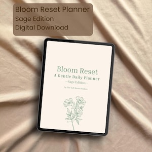 May include: A digital tablet displaying the cover of the "Bloom Reset Planner, Sage Edition." The cover features the text "Bloom Reset, A Gentle Daily Planner - Sage Edition - by The Soft Reset Studios" with a floral illustration. The tablet is set against a neutral, textured background.
