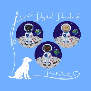 May include: Digital download featuring three dogs in astronaut suits on the moon, each with a planet Earth. The design includes a white dog silhouette and the text "Digital Download" and "Paws & Needles" on a light blue background.
