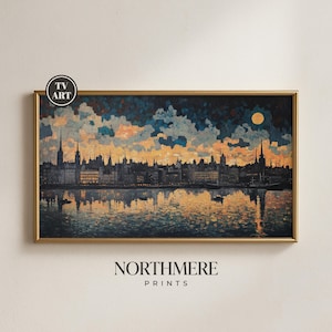 May include: A framed print of a cityscape at dusk, featuring a river reflecting the buildings and sky. The artwork has a gold frame and a warm color palette of blues, oranges, and yellows. The text "TV ART" and "NORTHMERE PRINTS" are visible.
