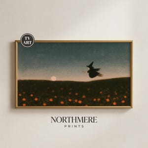 May include: A rectangular framed print featuring a dark landscape with a field of orange pumpkins under a twilight sky. A silhouette of a witch on a broomstick flies across the horizon near a pale moon. The text TV ART and NORTHMERE PRINTS appear.