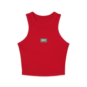 May include: A bright red crop top with a scoop neck and a small square patch featuring the word "BIG" in white letters on a green background. The top is sleeveless and made of a soft material.