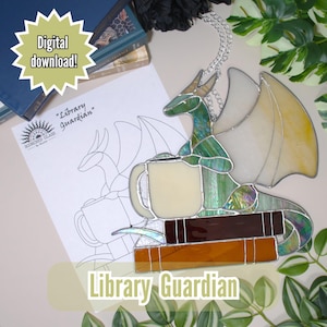 May include: Stained glass dragon holding a mug, perched atop books. The dragon is green, white, and iridescent. The image includes a line drawing and the text "Library Guardian" and "Digital download!"