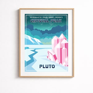 May include: A framed poster with a retro travel theme. The poster features a landscape with pink crystal formations, a blue and white icy terrain, and the text "CRYSTAL PEAK" and "PLUTO". The poster is framed in a light brown wooden frame.