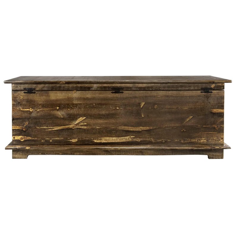 May include: A large, rectangular wooden storage chest with a hinged lid. The chest is made of dark brown wood with visible grain and knots, and features black metal hinges. The design is rustic and the chest sits on a low base.