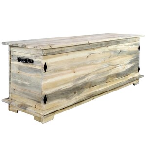 May include: A large, rectangular wooden chest with a light blue and tan colour scheme. The chest features a hinged lid, black metal hardware, and decorative diamond-shaped accents. The chest is approximately 152 cm long.