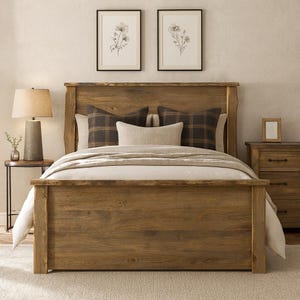 May include: A rustic wooden bed frame with a matching headboard. The bed is made with natural wood and features a warm, inviting tone. The bed is made with a white comforter and pillows. Two framed floral prints hang above the bed.
