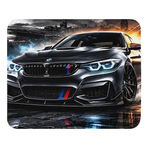 May include: A black BMW M4 sports car with blue and red stripes on the front. The car has a sleek design with black rims and is set against a city skyline background. The headlights are bright white.