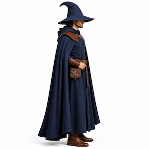 May include: A dark blue hooded cloak and matching pointed hat worn with brown leather shoulder armor, a brown leather belt with a buckle, a small brown leather pouch, and brown leather boots. The ensemble features a long, flowing dark blue robe.