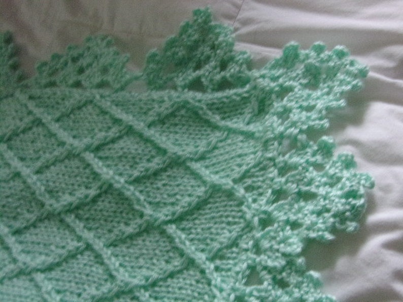 many colors Hand knit baby blanket in diamond pattern with crocheted border made to order