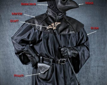May include: A black plague doctor costume by Tom Banwell Designs featuring a wide-brimmed hat, a bird-like beak mask, a balaclava, a leather mantle, a long robe, a belt with a pouch, and a staff with a winged emblem. The components are labeled.