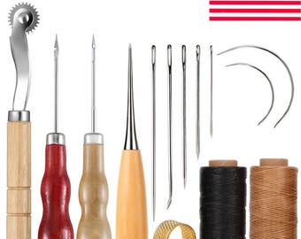 May include: A leathercraft tool kit featuring various tools, including needles, awls, a rotary cutter, and spools of black and tan thread. A gold thimble and curved needles are also included. The tools have wooden and metal components.