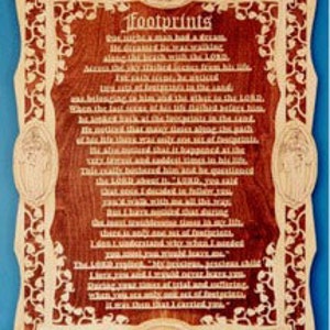 May include: A wooden plaque with a brown background and a beige border. The plaque features a poem titled "Footprints" about a man walking with God. The poem is written in a white font.