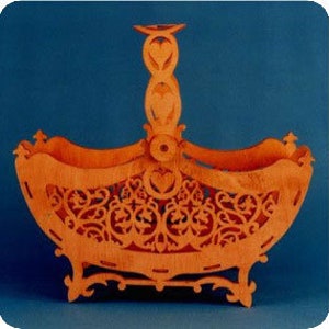 May include: A wooden basket with intricate cutouts in the shape of hearts and flowers. The basket has a handle and a base with decorative feet.