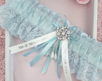 Luxury blue personalised wedding garter, light blue lace bridal garter with name and date personalised ribbons, something blue gift