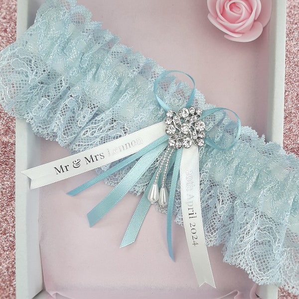 Luxury blue personalised wedding garter, light blue lace bridal garter with name and date personalised ribbons, something blue gift