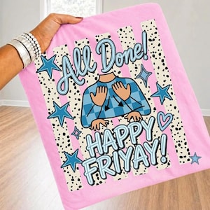 May include: A pink fabric item featuring a graphic print with the text All Done! HAPPY FRAYAY! The design includes a blue checkered shirt illustration, black and white spotted vertical stripes, and blue star and heart shapes on a pink background.