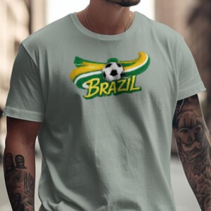Grey t-shirt with "Brazil" logo featuring a soccer ball and green and yellow stripes.