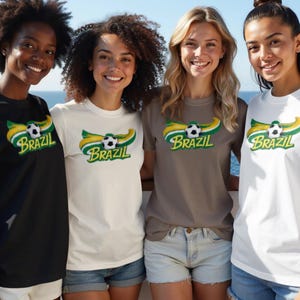 Four women smile wearing Brazil soccer t-shirts on a boat.