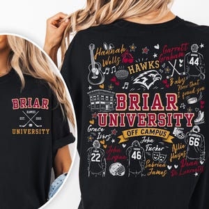 May include: A black t-shirt featuring a small Briar University logo on the front left chest. The back displays a large graphic with the text Briar University, Off Campus, and various illustrations including hockey players, a guitar, and names.