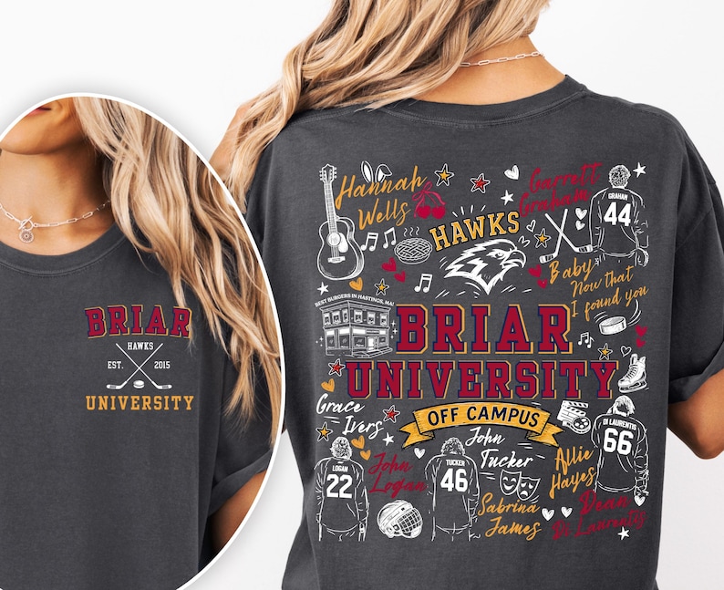 May include: A charcoal gray t-shirt featuring Briar University Hawks graphics. The front has a small logo with crossed hockey sticks. The back displays a large collage of names, hockey jerseys, a guitar, and the text Briar University Off Campus.