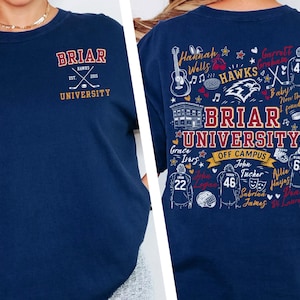 May include: A navy blue t-shirt featuring a small Briar University Hawks logo on the front left chest. The back displays a large, detailed graphic with the text Briar University Off Campus, surrounded by hockey-themed illustrations and names.