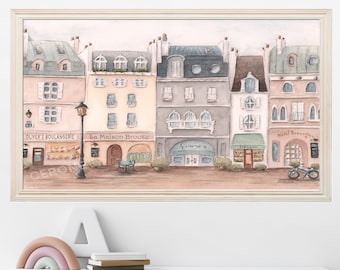 May include: A watercolour painting depicting a Parisian street scene with five buildings, each featuring a shopfront. The buildings are painted in soft pastel colours, with pink, blue, and yellow accents. The shopfronts display signs that read "Oliver's Boulangerie", "La Maison Brooke", "Giovanni's", "Pâtisserie", and "Hotel Kensington".