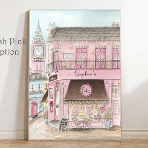 May include: A watercolor illustration of a pink building with a brown awning that says "Sophia's Cakes". The building has a clock tower and a sign that says "Sophia Street".