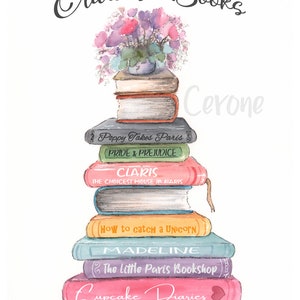 May include: A stack of colorful books with titles like "Poppy Takes Paris", "Pride & Prejudice", "Claris", "How to catch a Unicorn", "Madeline", "The Little Paris Bookshop", and "Cupcake Diaries". A bouquet of pink, purple, and white flowers sits on top of the stack.