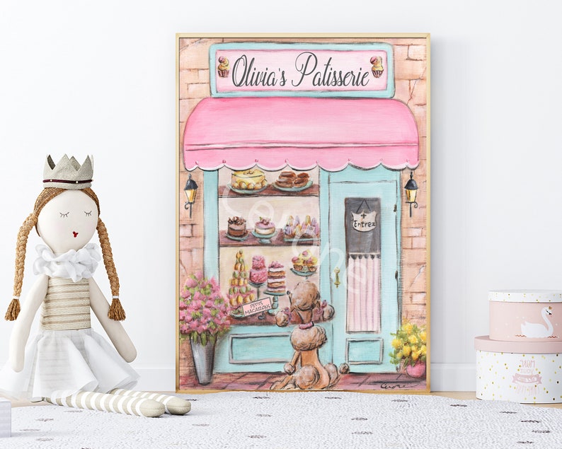 May include: A watercolor painting of a pink and blue storefront with the words "Olivia's Patisserie" above the door. The storefront has a display of pastries and cakes inside. A poodle dog stands outside the shop.